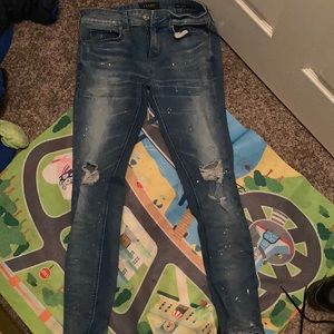PacSun ripped paint splash jeans